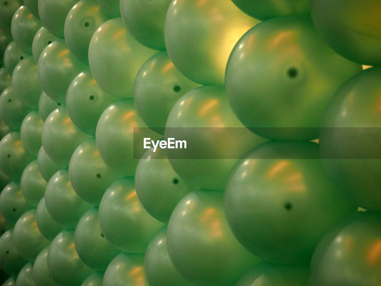 Full frame shot of green balloons