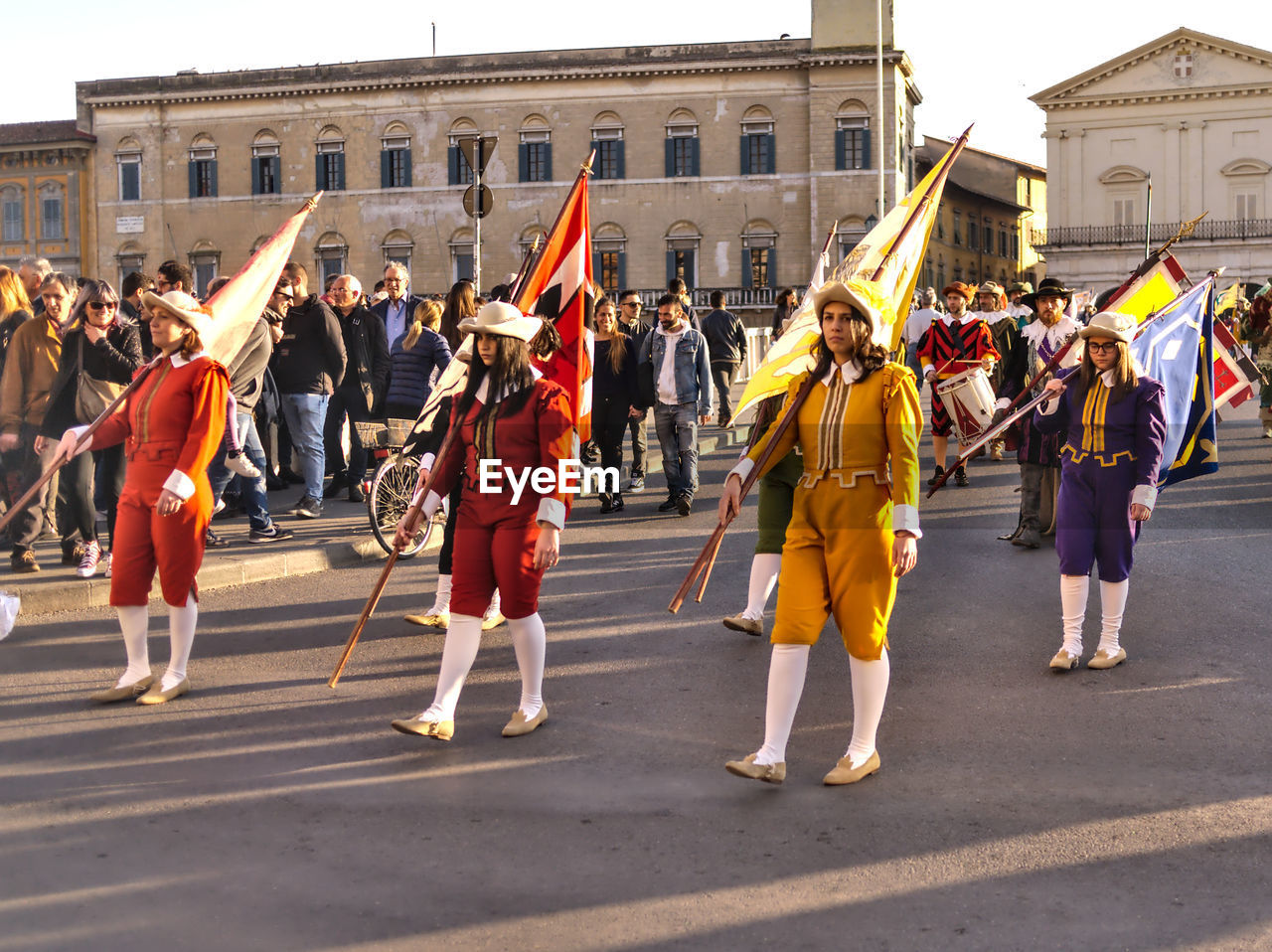 GROUP OF PEOPLE AT STREET IN CITY