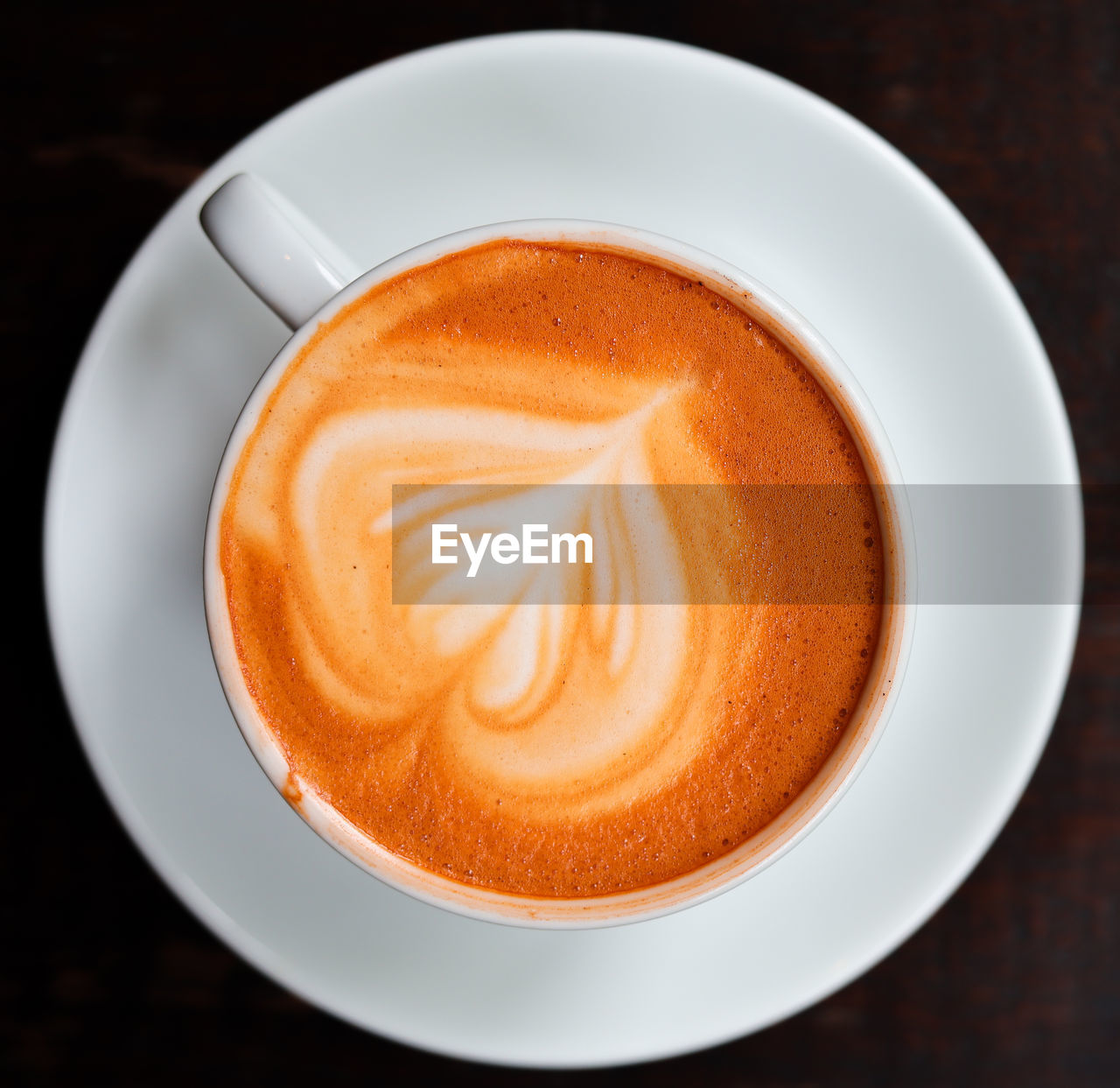 High angle view of cappuccino on table