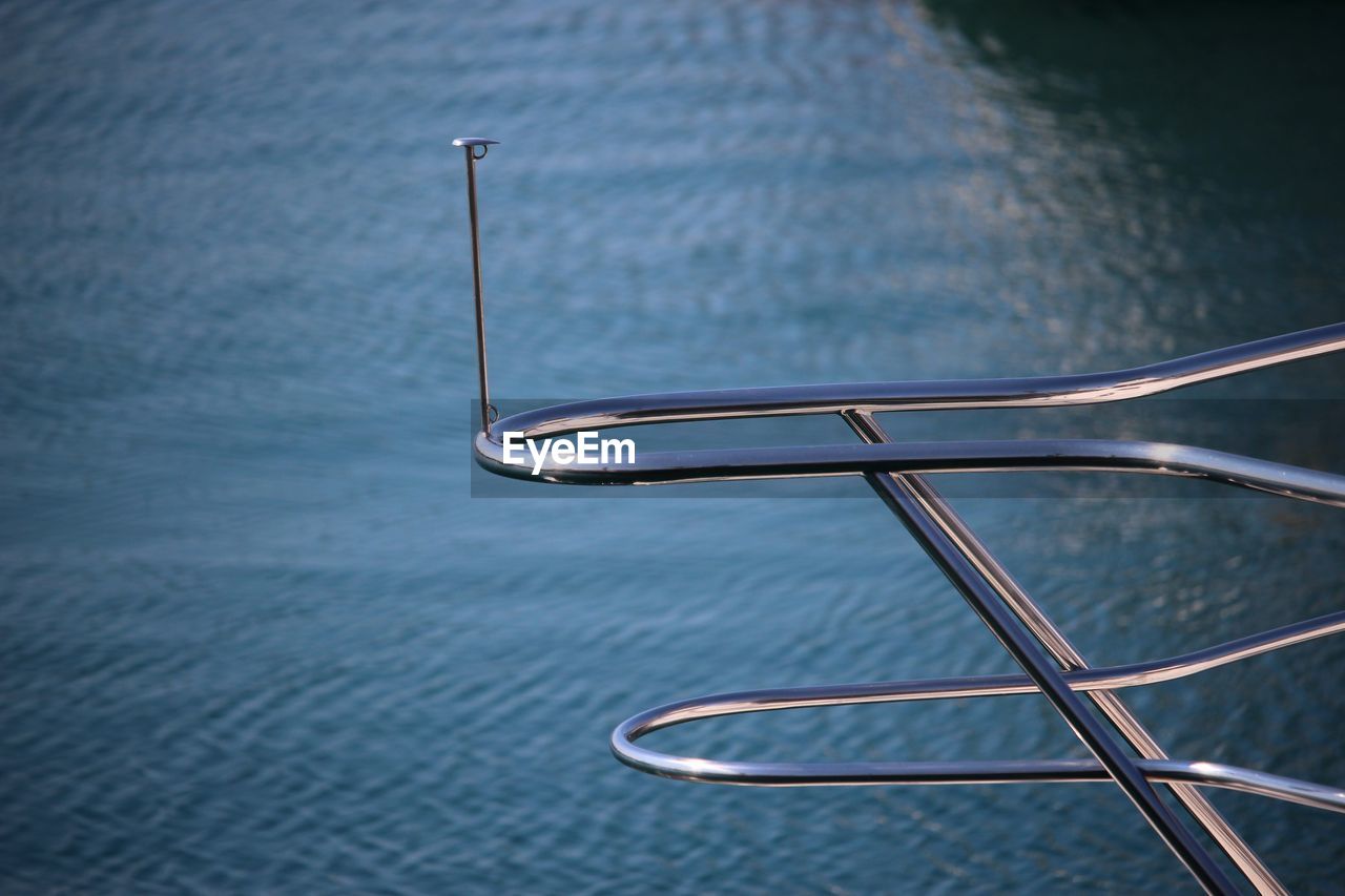 Close-up of boat railing on sea