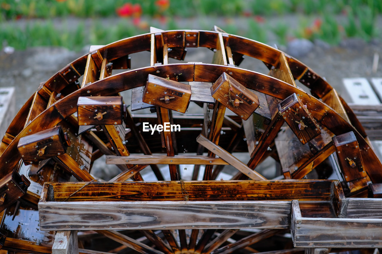 High angle view of wet water wheel at watermill