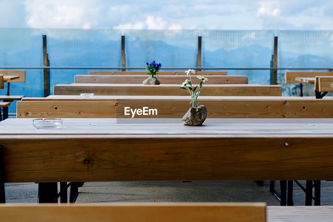 Tables and benches arranged in cafe