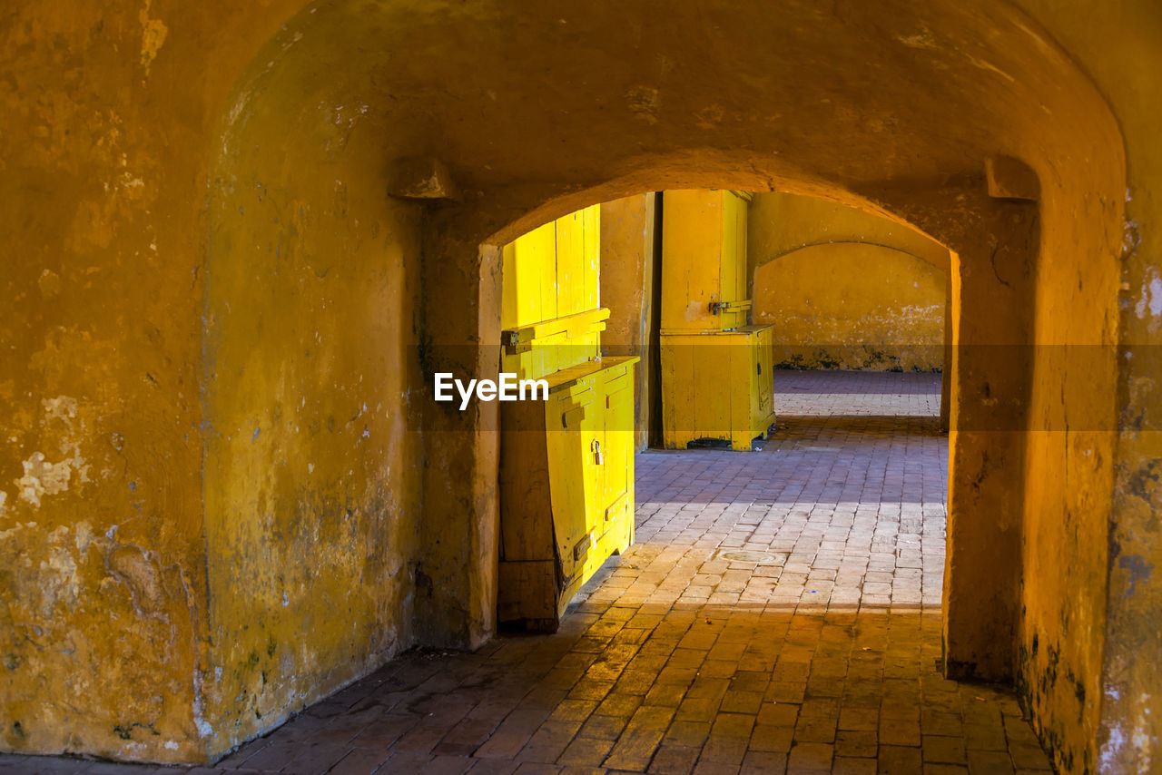 Yellow archway on sunny day