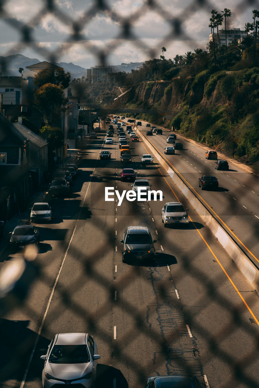 HIGH ANGLE VIEW OF CARS ON ROAD