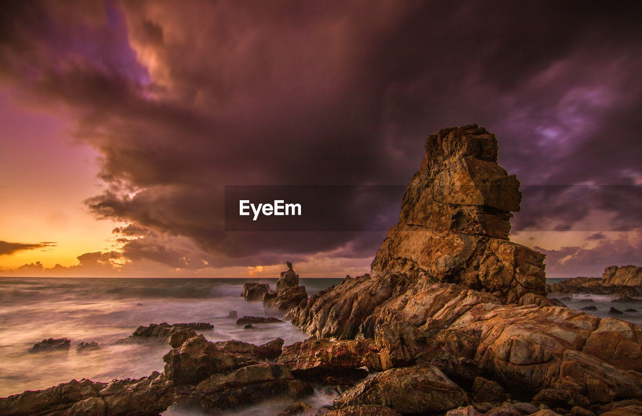 Scenic view of sea against dramatic sky