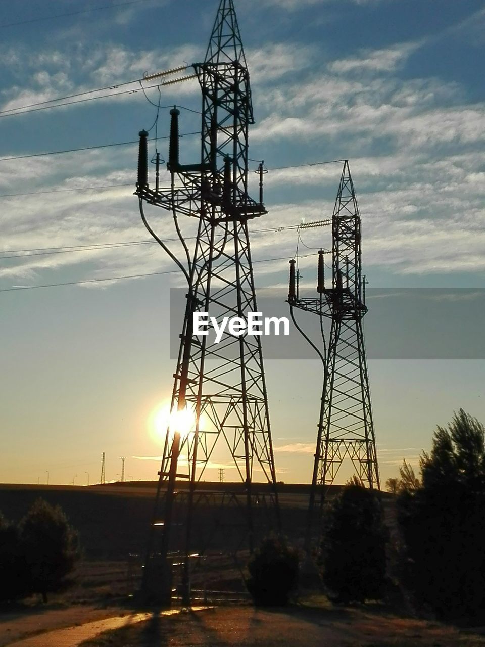 LOW ANGLE VIEW OF ELECTRICITY PYLONS AGAINST SKY