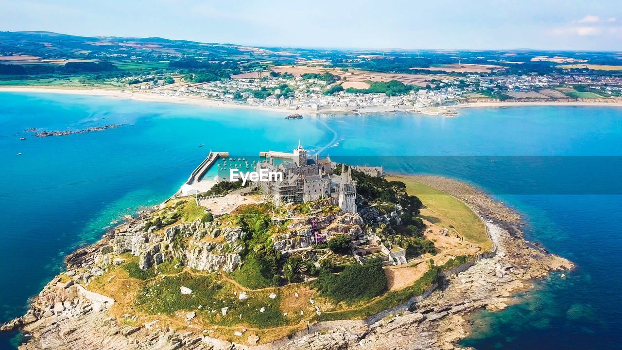 HIGH ANGLE VIEW OF BAY AGAINST CLEAR SKY