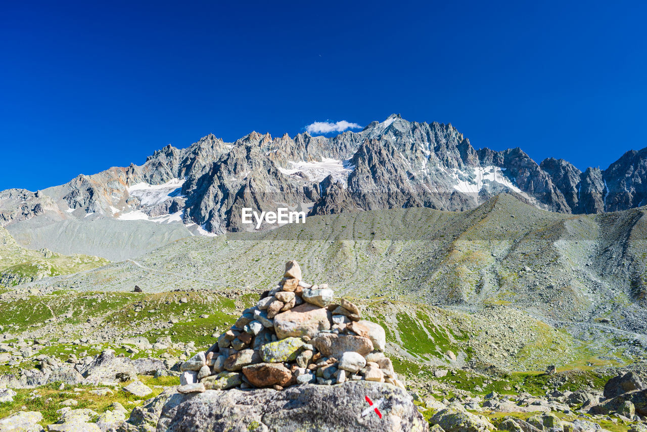 SCENIC VIEW OF MOUNTAIN AGAINST BLUE SKY