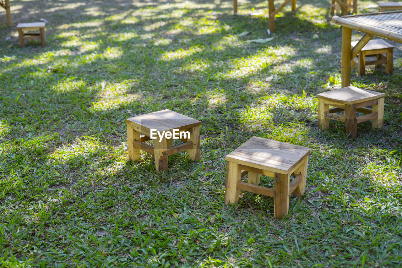 Bamboo bench, bamboo carriage in the green grass, made of strong and durable for use.