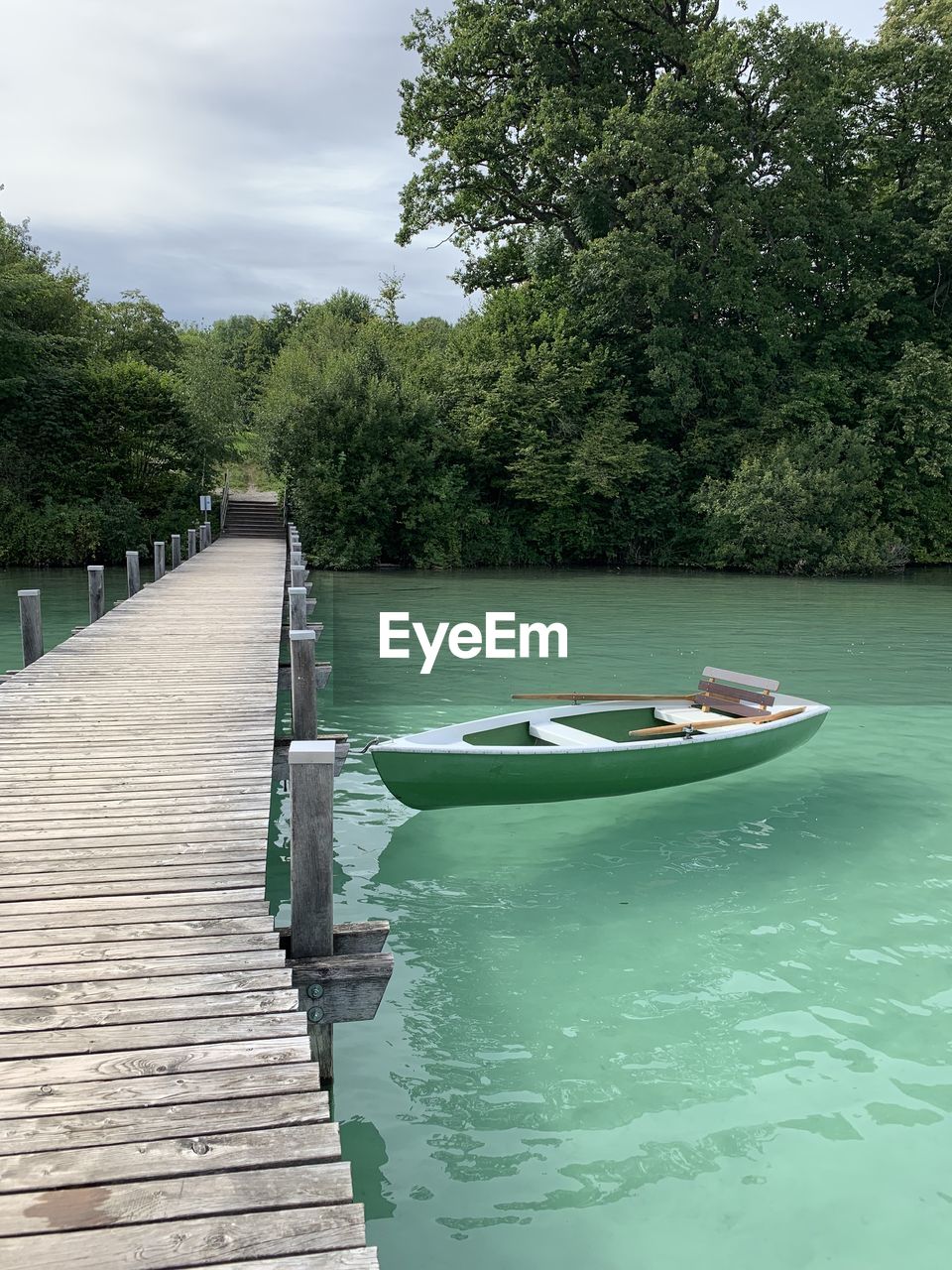 PIER AMIDST LAKE AGAINST SKY