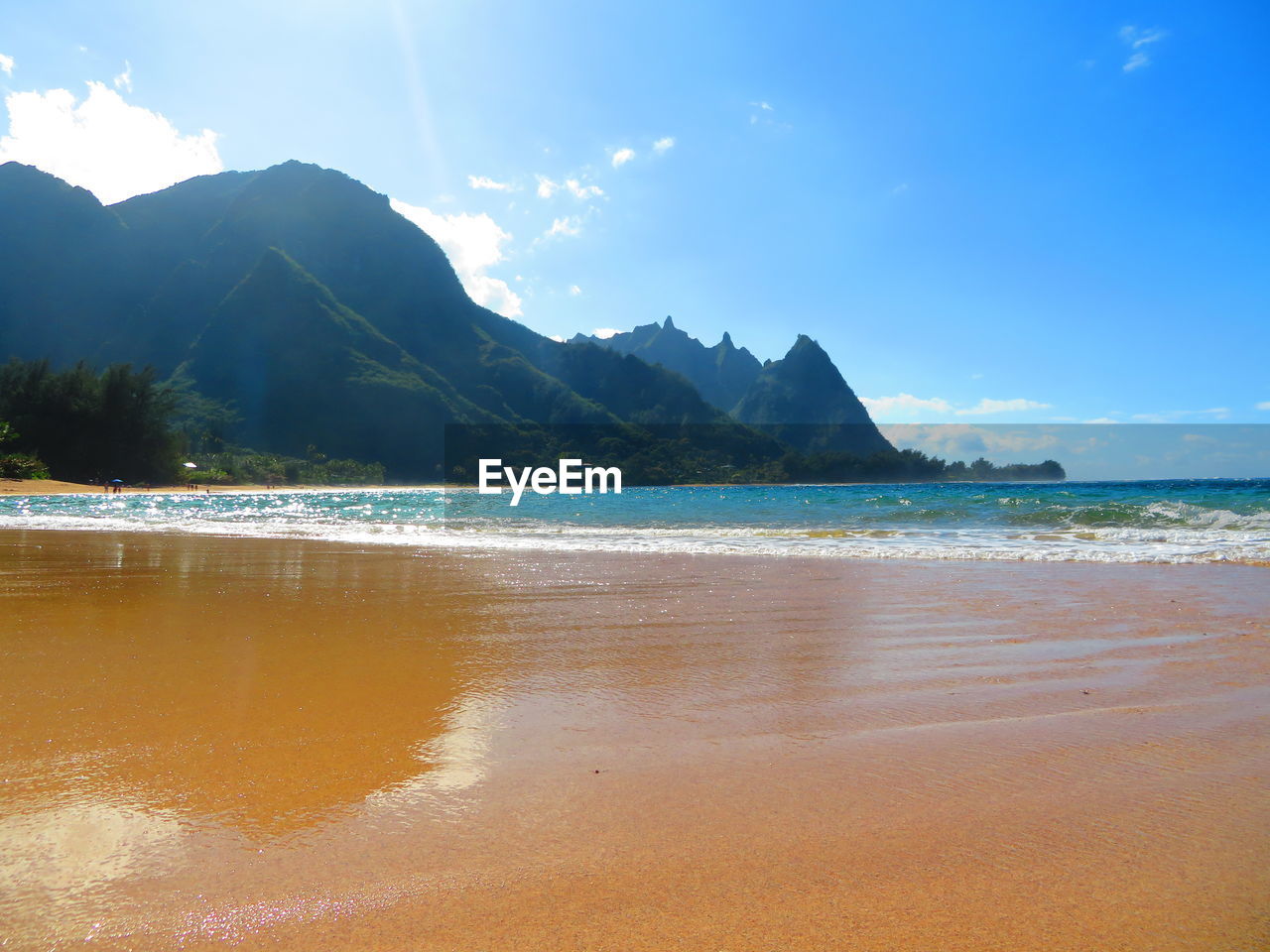 water, land, sea, sky, beach, scenics - nature, body of water, beauty in nature, mountain, nature, sand, travel destinations, tranquility, ocean, environment, travel, landscape, shore, coast, tranquil scene, cloud, bay, holiday, blue, coastline, trip, vacation, horizon, wave, tourism, no people, summer, idyllic, outdoors, sunlight, tropical climate, water's edge, sun, island, sports, day, sunny, tree, seascape, wind wave, water sports, motion, bay of water, mountain range, relaxation, lagoon, panoramic