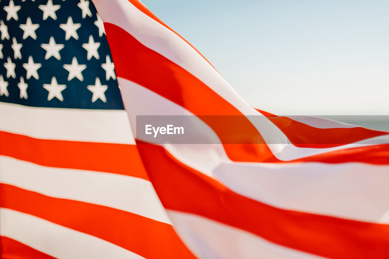 Close-up of flag against blue sky