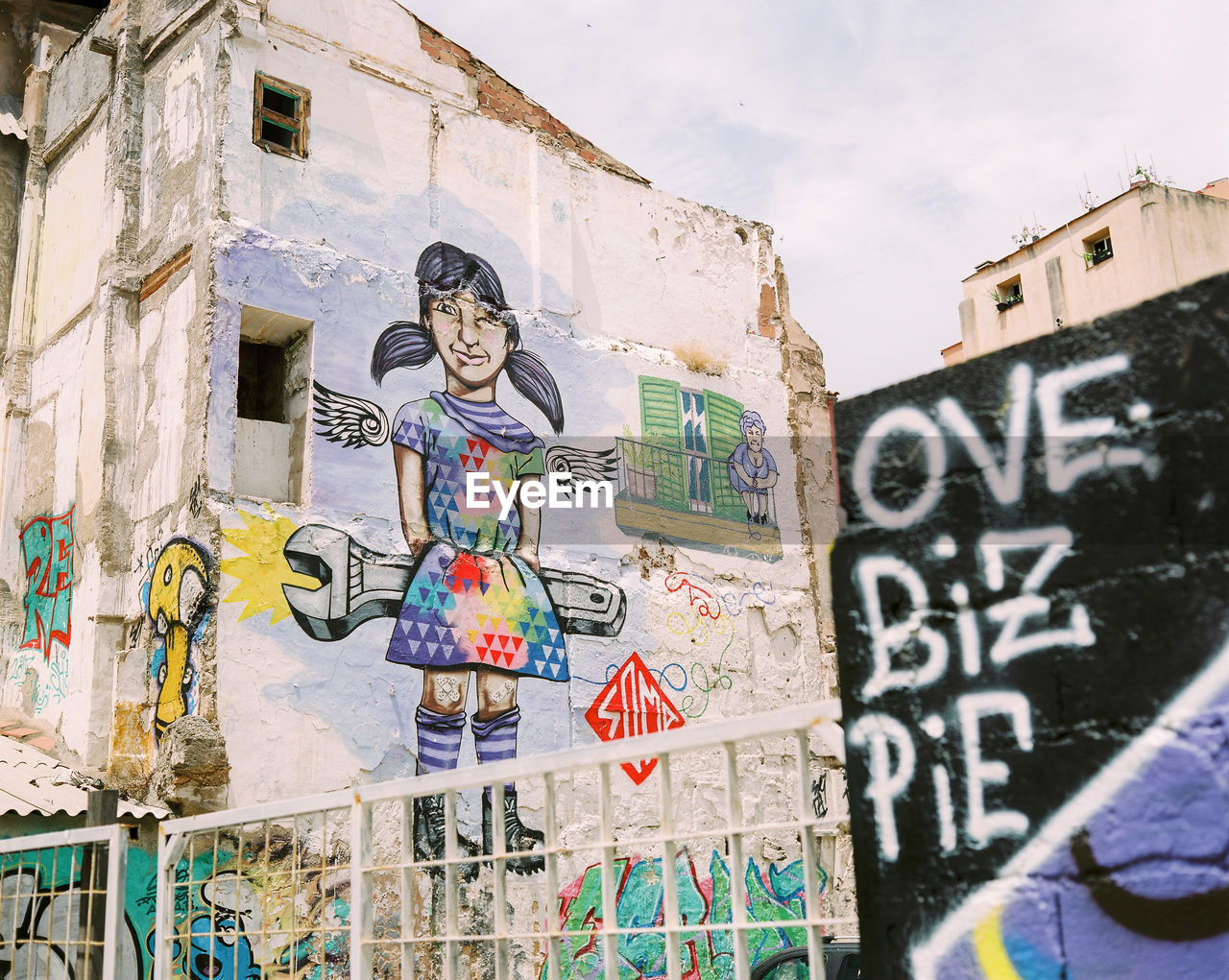 GRAFFITI ON WALL WITH TEXT AND BRICK WALLS