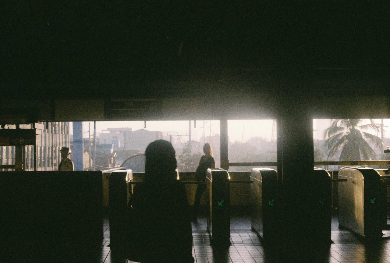 Silhouette of man in window