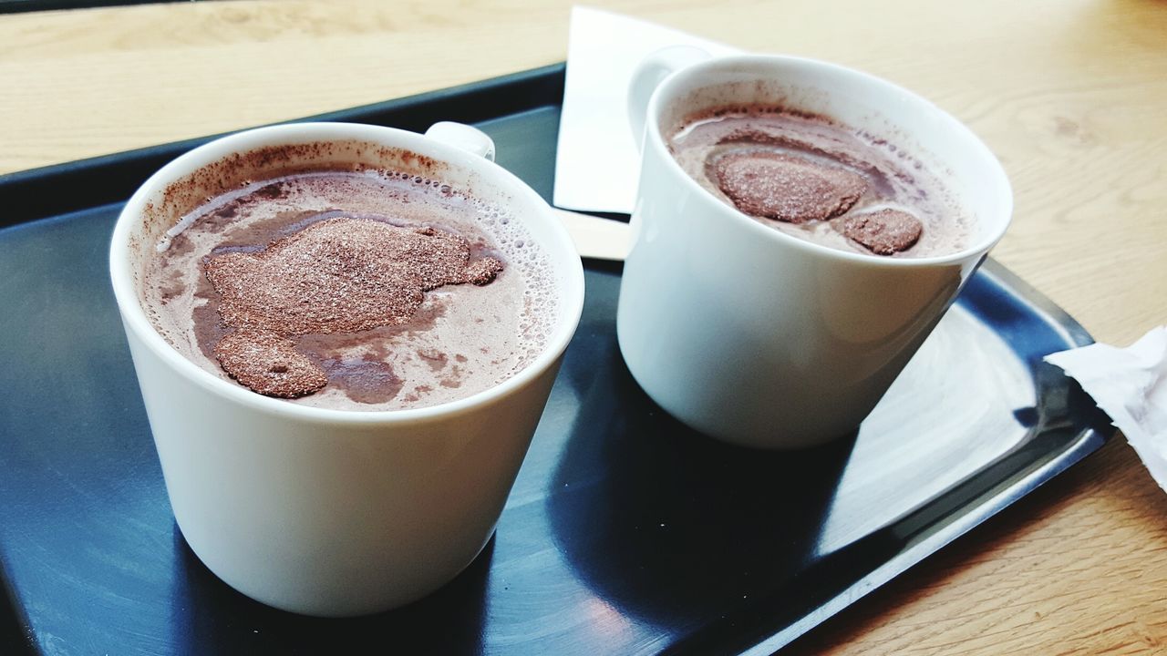 Close-up of cappuccino served on table