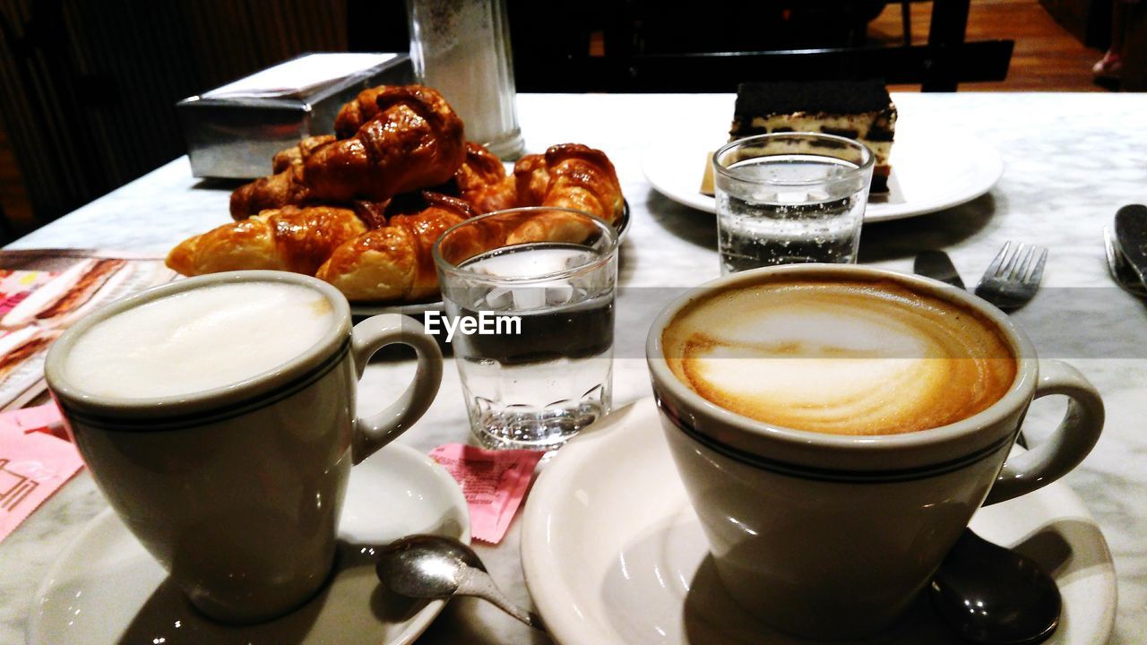 CLOSE-UP OF FOOD SERVED WITH COFFEE ON TABLE