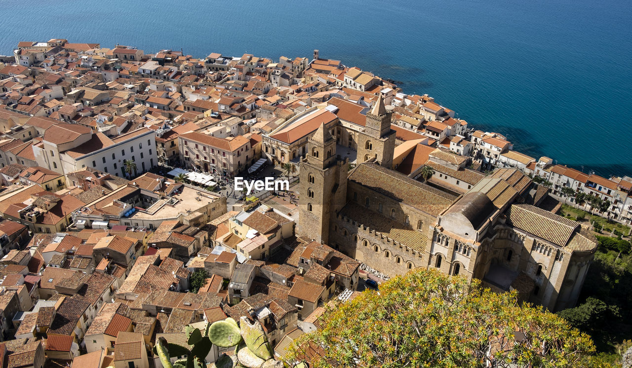 High angle view of townscape by sea