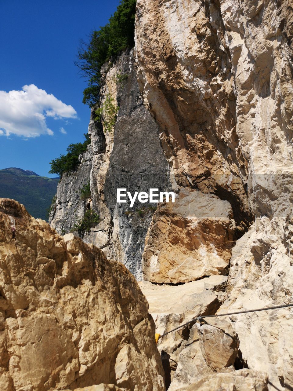 LOW ANGLE VIEW OF ROCK FORMATION ON LAND AGAINST SKY