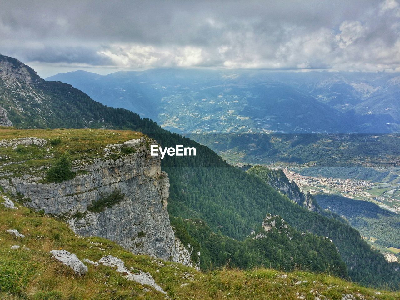 High angle view of mountains against cloudy sky