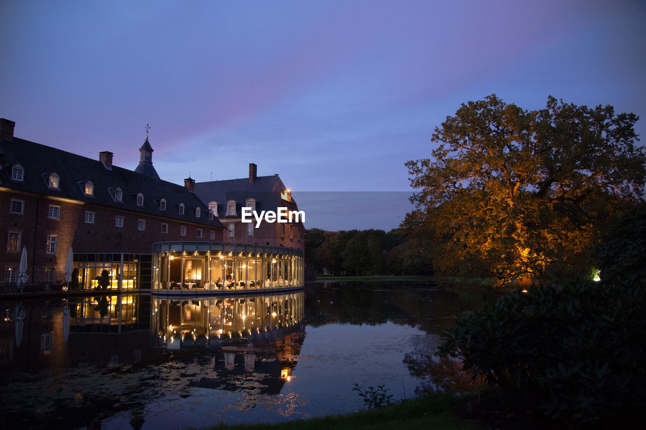 REFLECTION OF ILLUMINATED BUILDINGS IN WATER