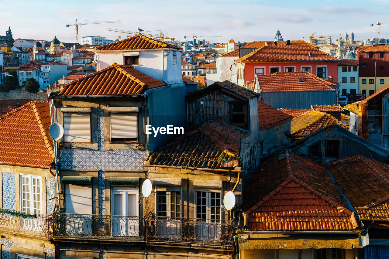 Houses in town against sky