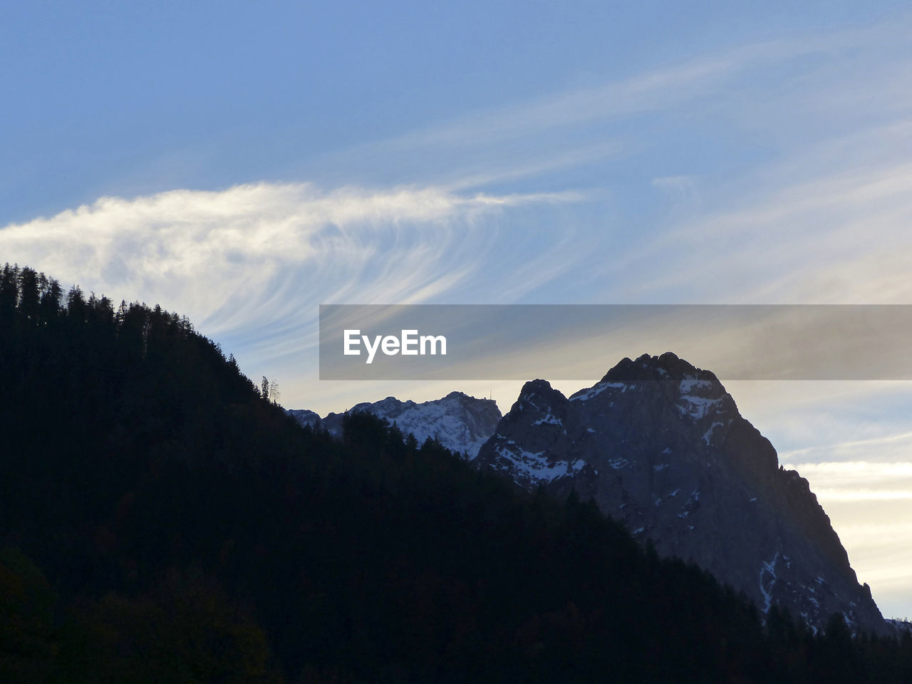 scenic view of mountains against sky during sunset