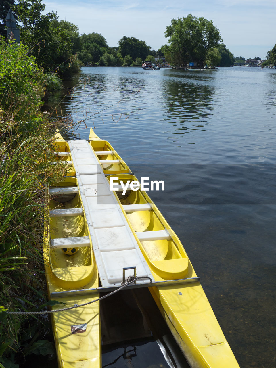 HIGH ANGLE VIEW OF YELLOW FLOATING IN LAKE