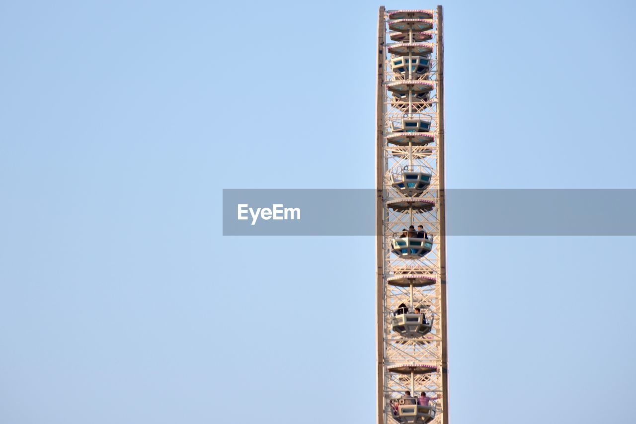 Low angle view of building against clear blue sky