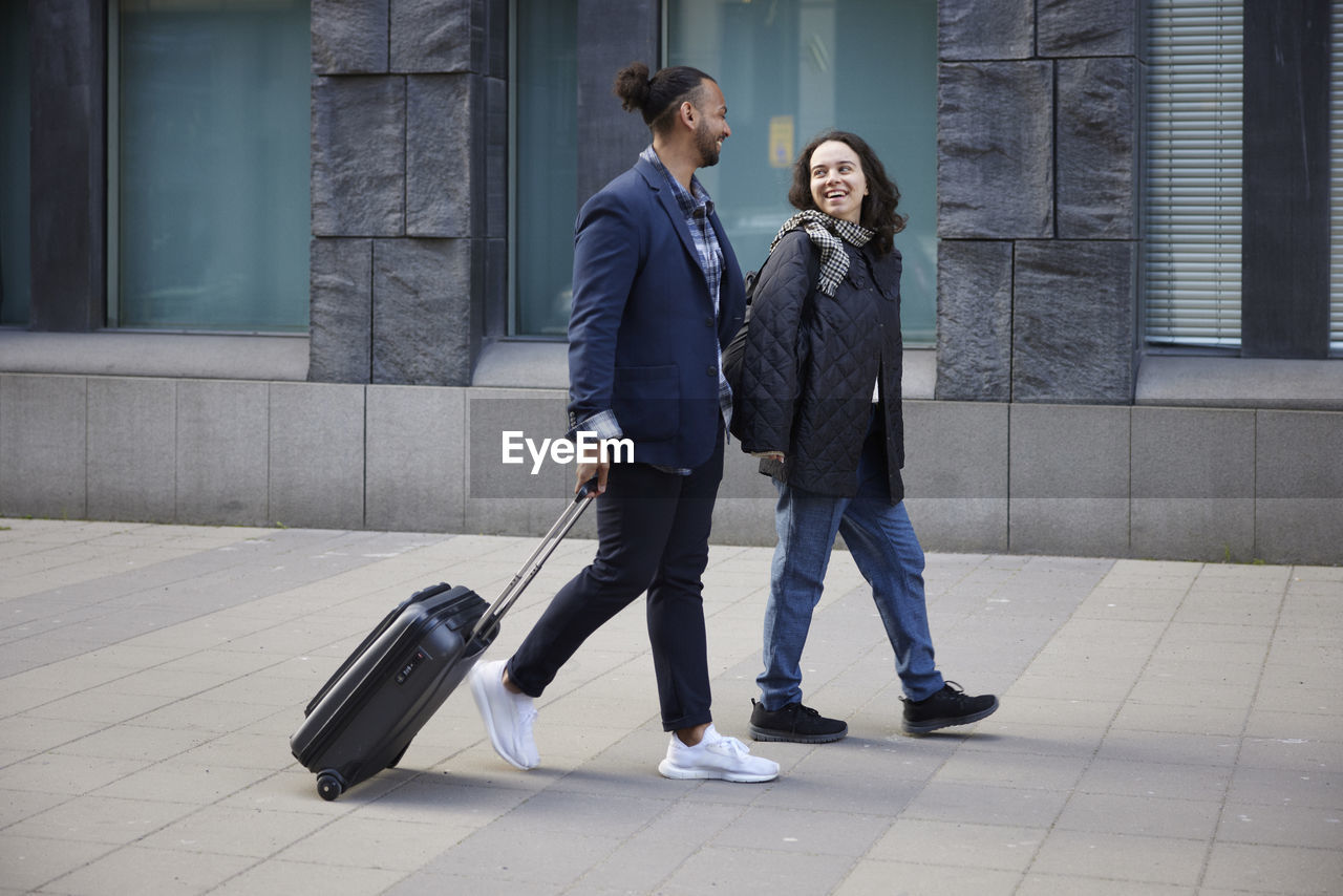 Smiling couple walking together