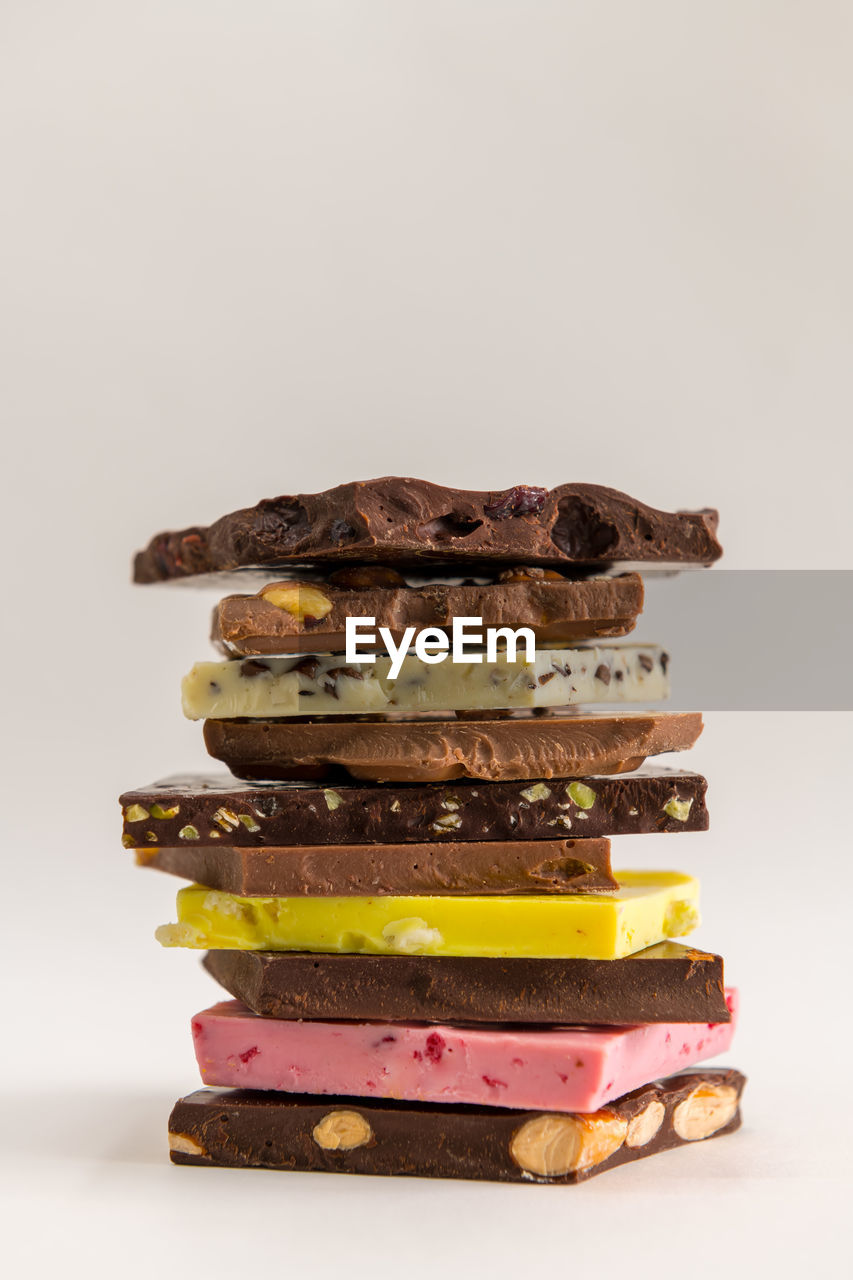 Stack of chocolate against white background