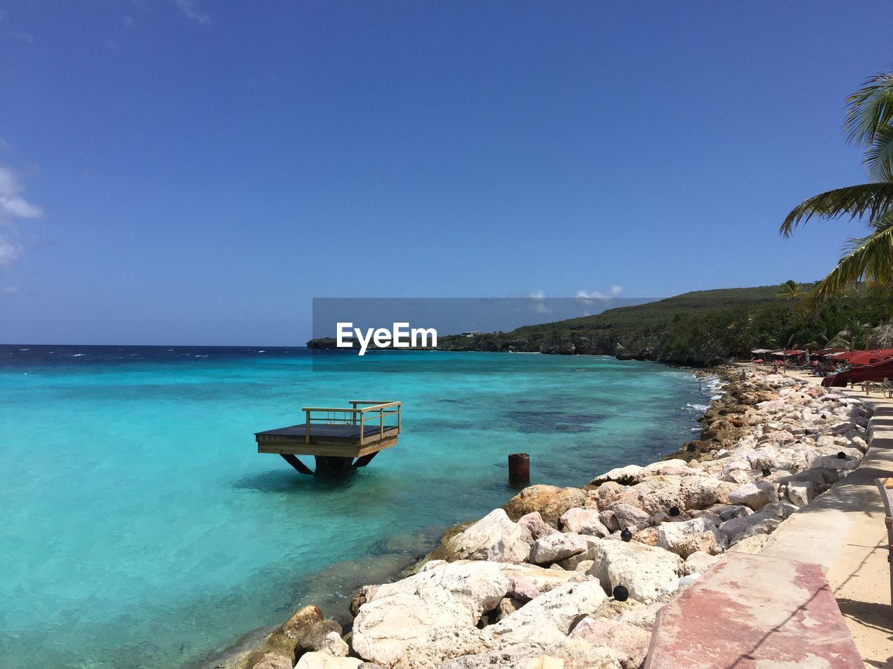 Scenic view of sea against clear blue sky