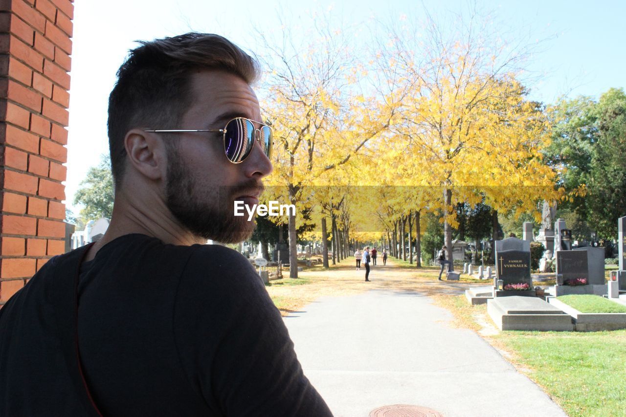 Close-up of young man looking away