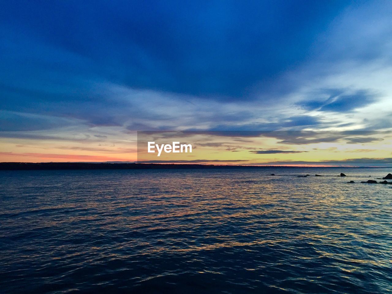 View of calm sea at sunset