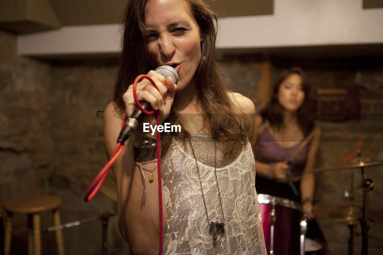 Young musicians practicing at a rehearsal space