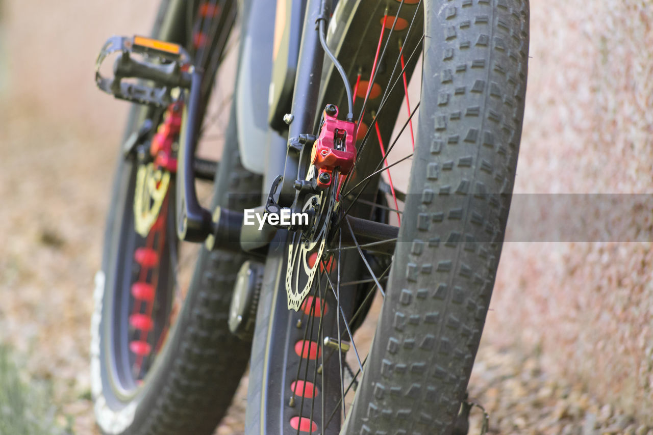 Close-up of bicycle parked on field