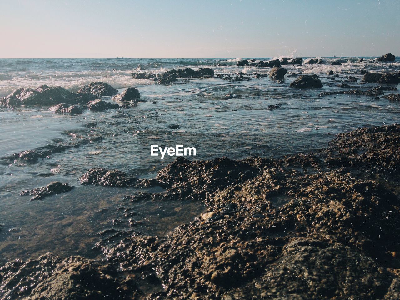 Scenic view of sea against clear sky