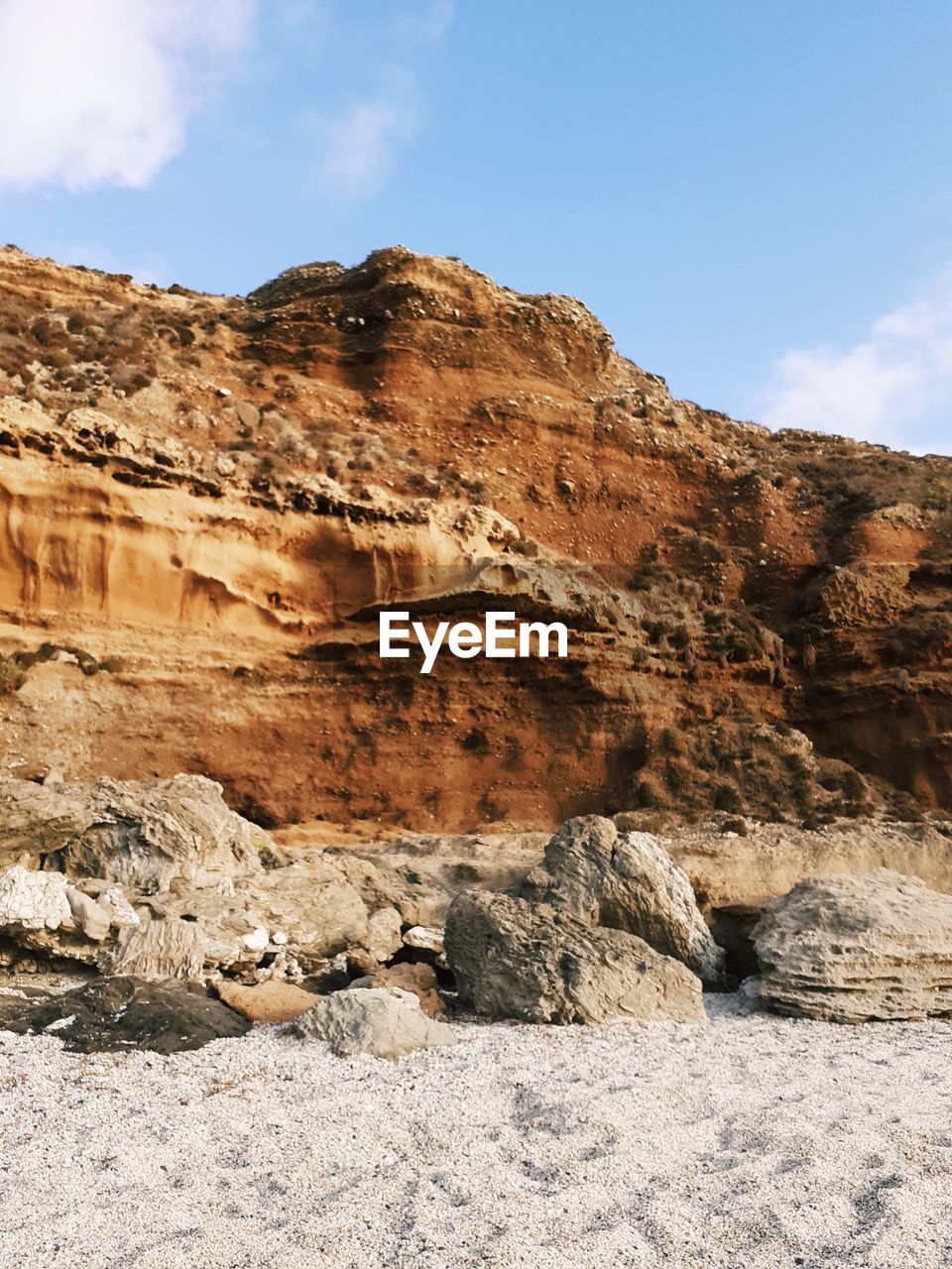 ROCK FORMATIONS ON MOUNTAIN AGAINST SKY