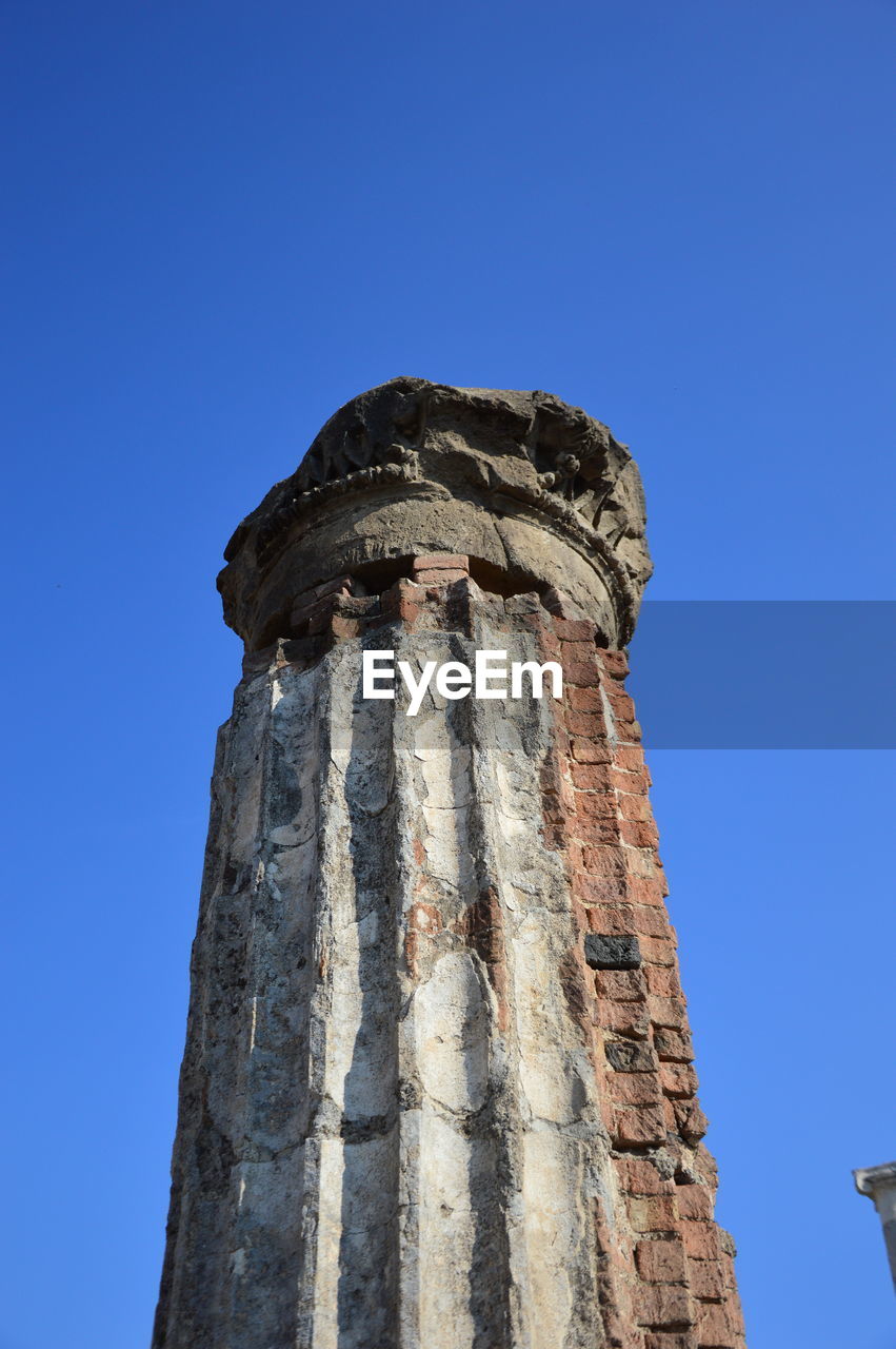 LOW ANGLE VIEW OF TOWER AGAINST BLUE SKY