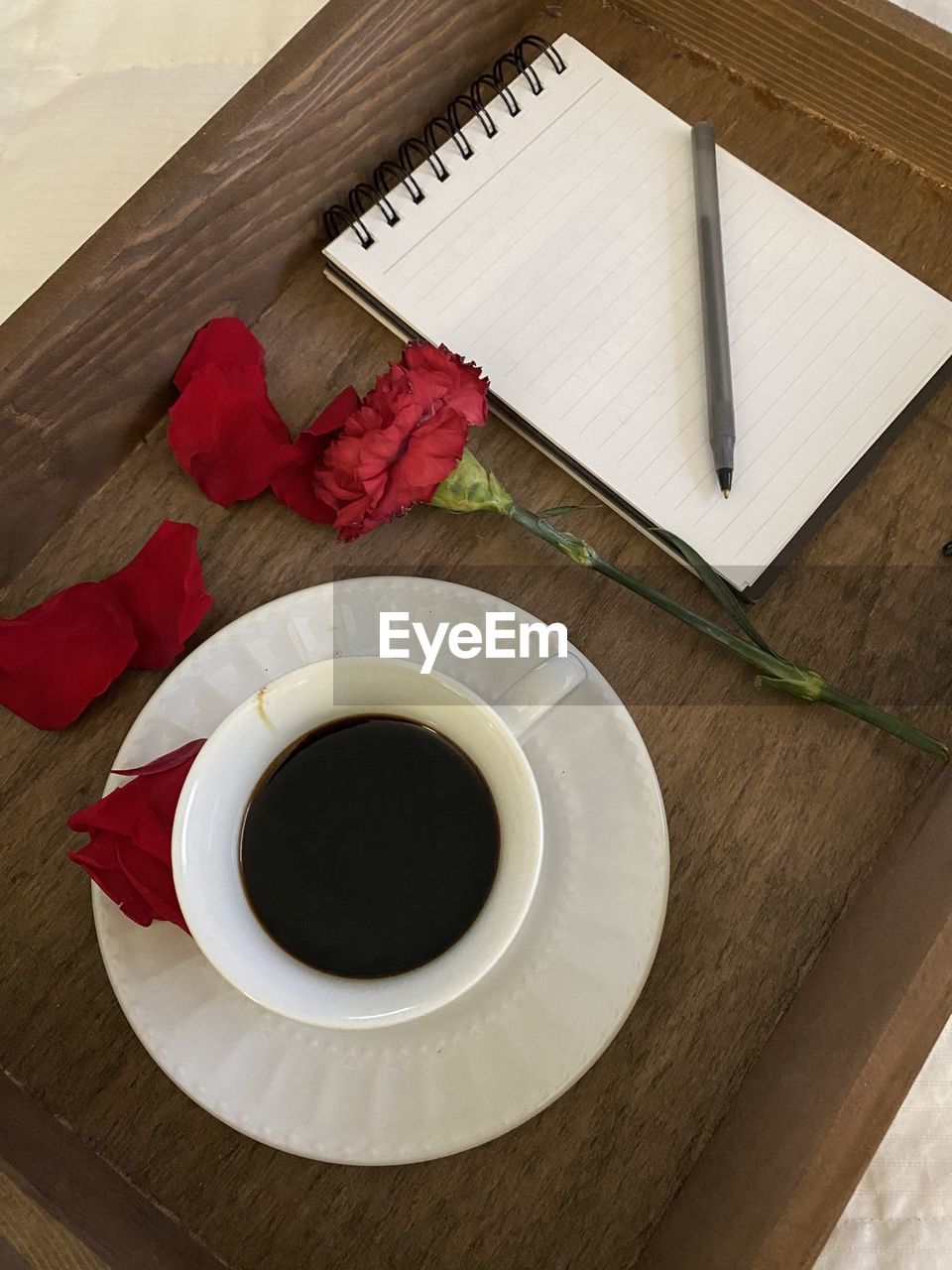 food and drink, table, drink, wood, high angle view, cup, mug, coffee, coffee cup, red, refreshment, indoors, freshness, directly above, crockery, still life, art, no people, paper, food, flower, hot drink