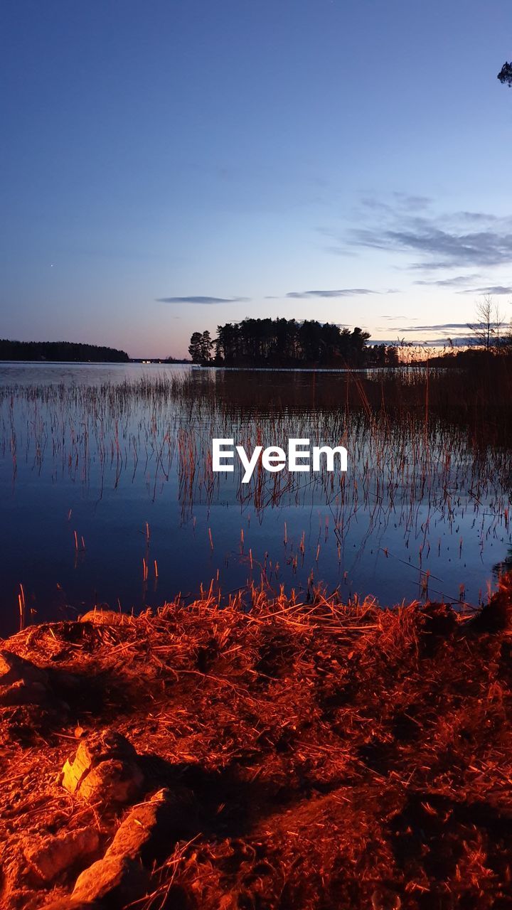 SCENIC VIEW OF LAKE AGAINST SKY