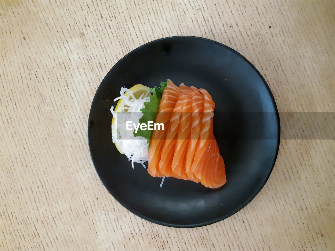 HIGH ANGLE VIEW OF SUSHI SERVED IN PLATE ON TABLE