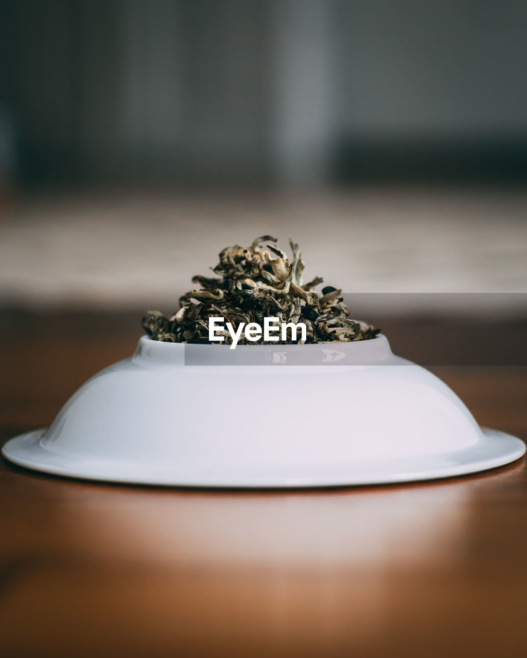 Close-up of tea leaves in plate on table