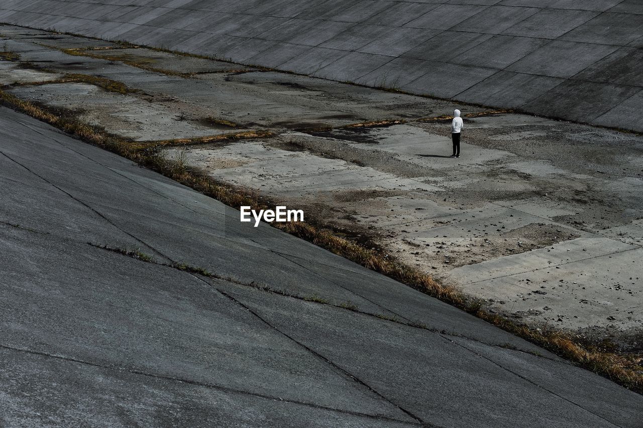 High angle view of man walking on dry riverbed