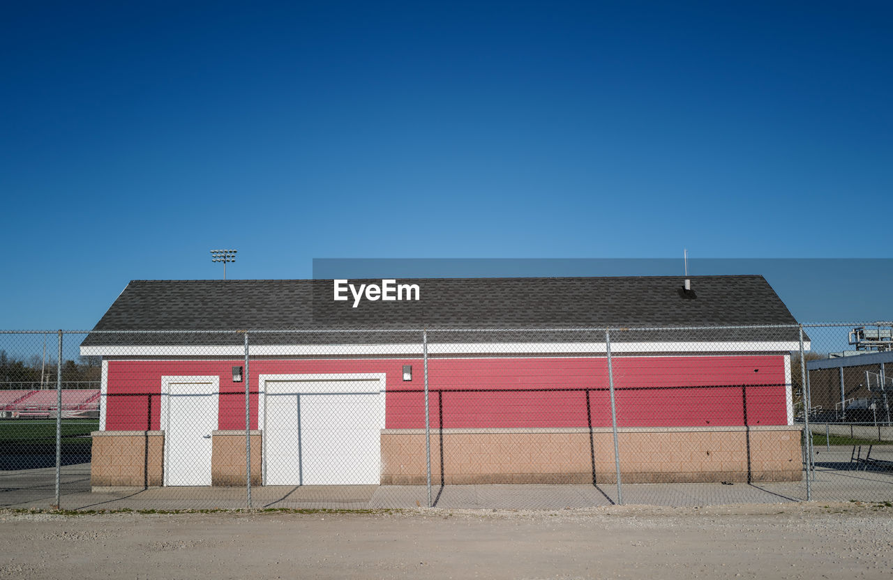 Closed red stadium storage shed