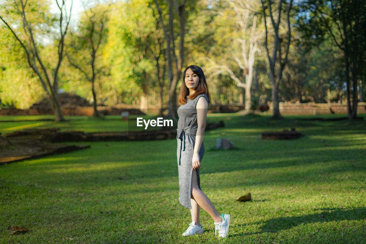 Portrait of woman walking in park