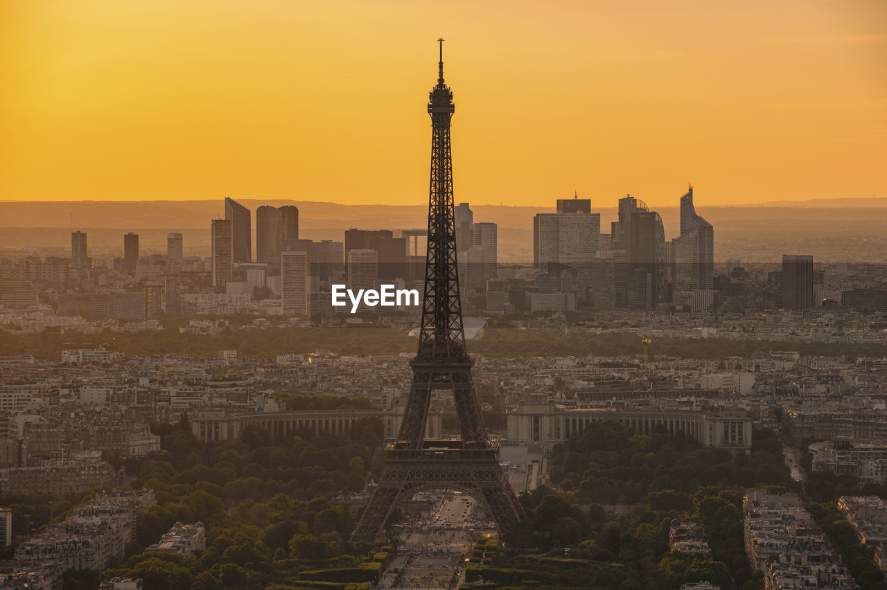 View of eiffel tower in city during sunset