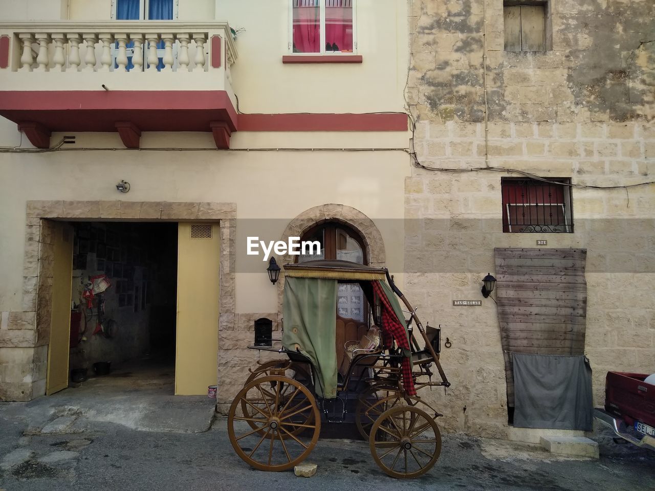 BICYCLES PARKED AGAINST BUILDING