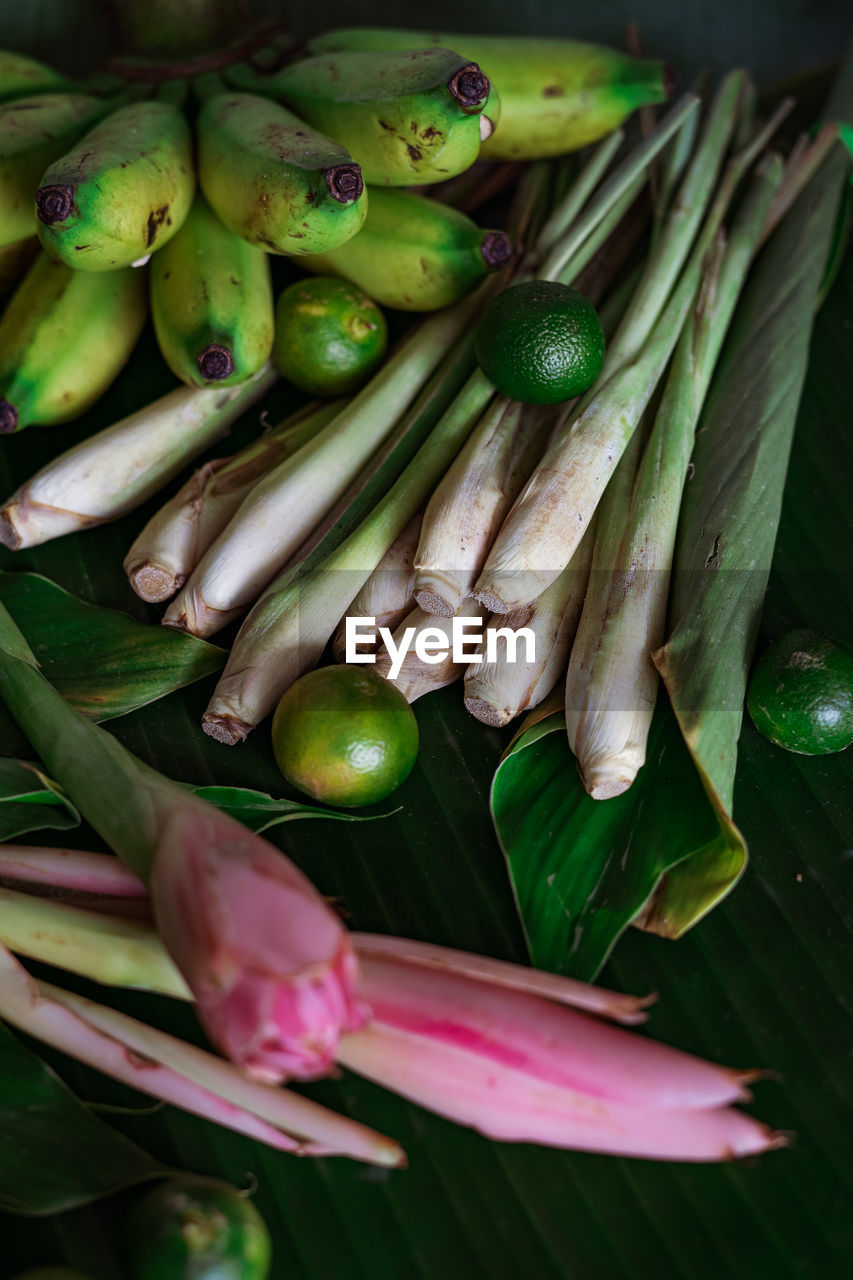 HIGH ANGLE VIEW OF FRESH VEGETABLES IN GREEN CONTAINER