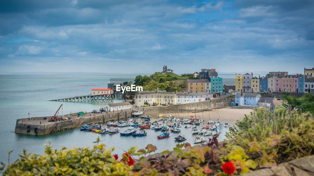 Scenic view of sea and buildings against sky