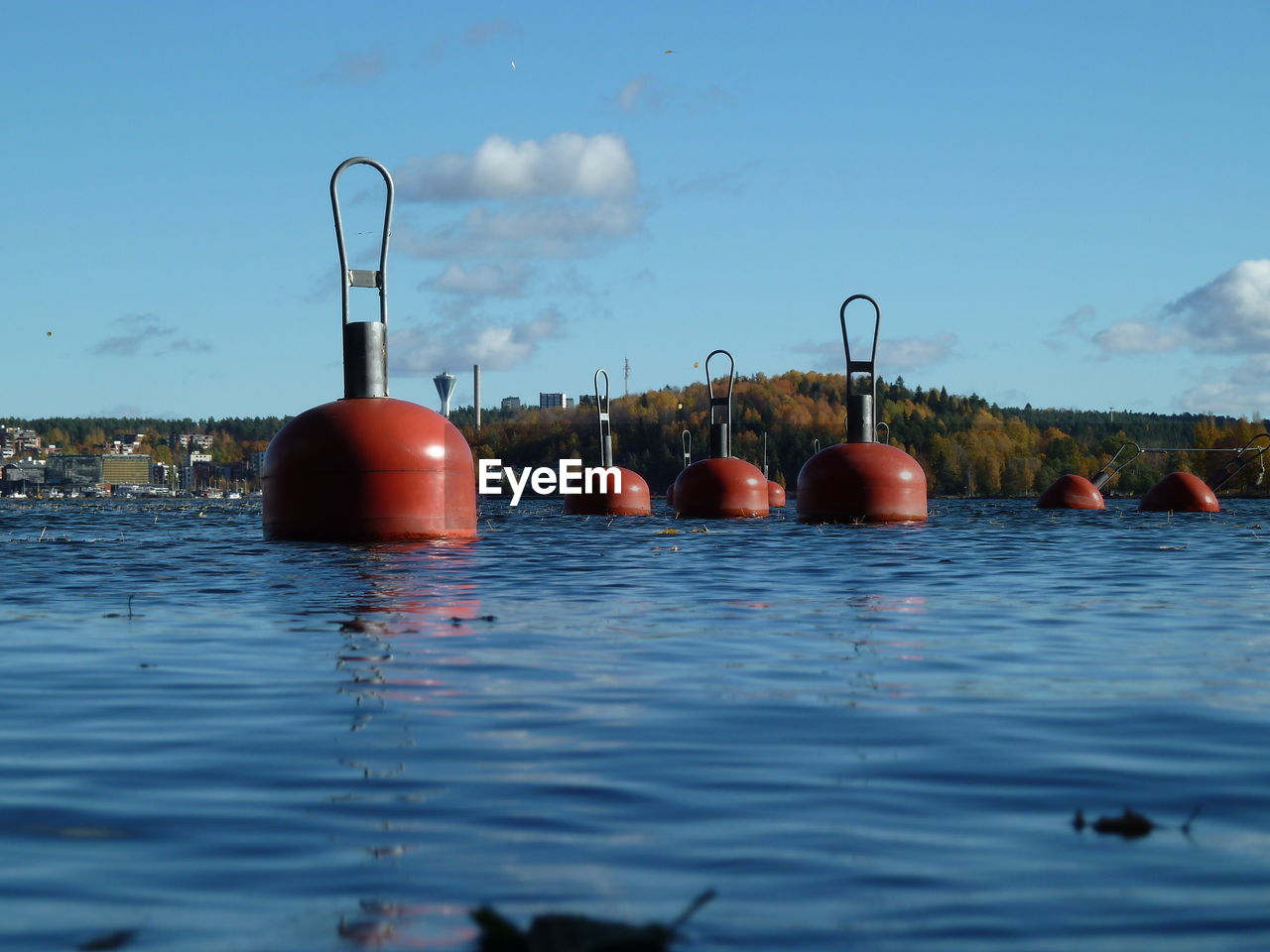 water, buoy, sea, sky, nature, no people, blue, swimming, day, reflection, boating, outdoors, food and drink, food, floating on water, floating, cloud, red